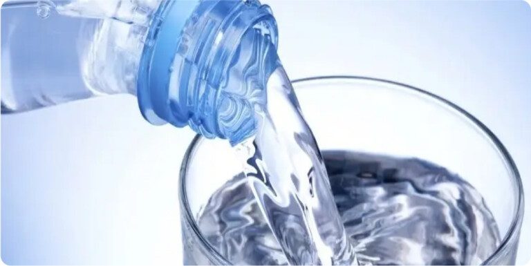 Bottled water in glass.